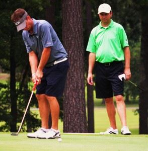 Jeremy McGatha (L) sinks a birdie putt on 18 to clinch the Dub Ellis Invitational at Cherokee County CC with Matt Rogers looking on. In the main photo, McGatha is congratulated by Bo Abney after the round. (Photos by Kurt Duryea)