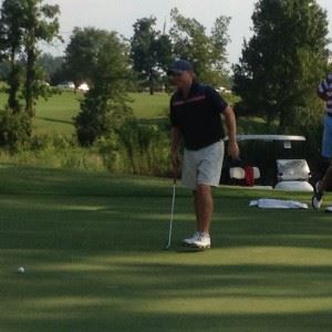 Freeman Fite approaches his team's first attempt at tying the Sunny King scramble record on their 17th green Friday. They missed there, but tied the mark on the next hole.