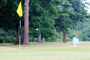 Cypress Hathorn doesn't like where this ball is headed out of the bunker on 18.