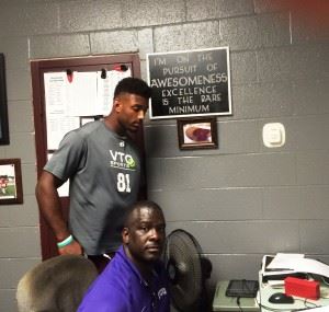 Justin Foster (L) will fill a lot of roles for Donoho coach Shannon Felder this season. Notice the message on the plaque above Foster's head.