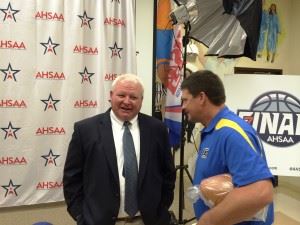 Piedmont coach Steve Smith (R) talks about the upcoming Champions Challenge game with Dadeville coach Richard White today in Montgomery. In the main photo, Smith (far right) and White (third from left) are joined by the other coaches playing in the series.