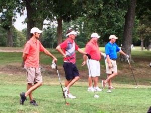 The four players in the leaders group -- (from left) Eric Cannington, Jeremy McGatha, Benji Turley and Matt Rogers -- strike a similar pose as they look down the 14th fairway at Anniston Municipal Golf Course during the final round of the Buddy Moore Charity Classic Sunday. (Click photos to enlarge)