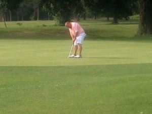 Grant Hockman drops his winning putt in the Fort McClellan Credit Union Pro-Invitational earlier this summer. He can win County Player of the Year by winning the County Championship this week. 