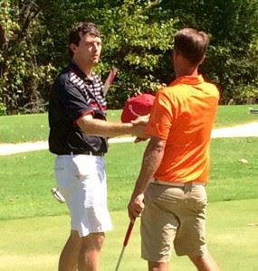 Andrew Brooks (L) gets a handshake from Jeremy McGatha after winning their County Match Play semifinal match Sunday. 