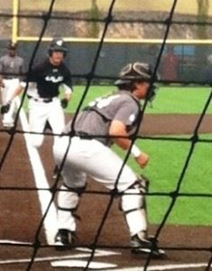 Peyton Whitten comes down the line to score an early run for the Excel Blue Wave in their World Wood Bat qualifying tournament title game Sunday.