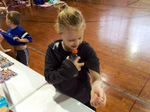 Seven-year-old Susan Tiffner of Oxford checks out her race schedule for the meet.