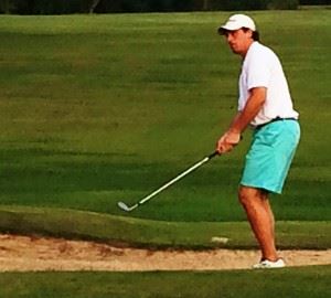 Andrew Brooks chips onto the 18th green for the birdie that sealed victory in his match with Clay Calkins. Below, Calkins blasts out of a bunker on No. 10 at Cane Creek.