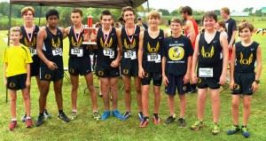 The Oxford boys cross-country team gets together after joining the girls team (cover) in sweeping the Creekbank Invitational at Oxford Lake Park. (All photos by Kurt Duryea)