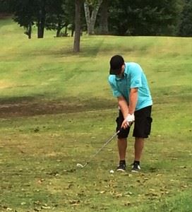 Josh Poole, shown here chipping in the Buddy Moore Tournament earlier this season, won his fourth straight Pine Hill CC club championship in a playoff.