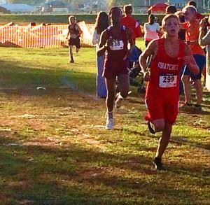 Ohatchee's Jimmy Wilson (R) holds a slim lead over Anniston's Zebadee Lunsford in the first half of Tuesday's County Cross Country Meet. Lunsford overtook the lead late (cover photo) and won the race.