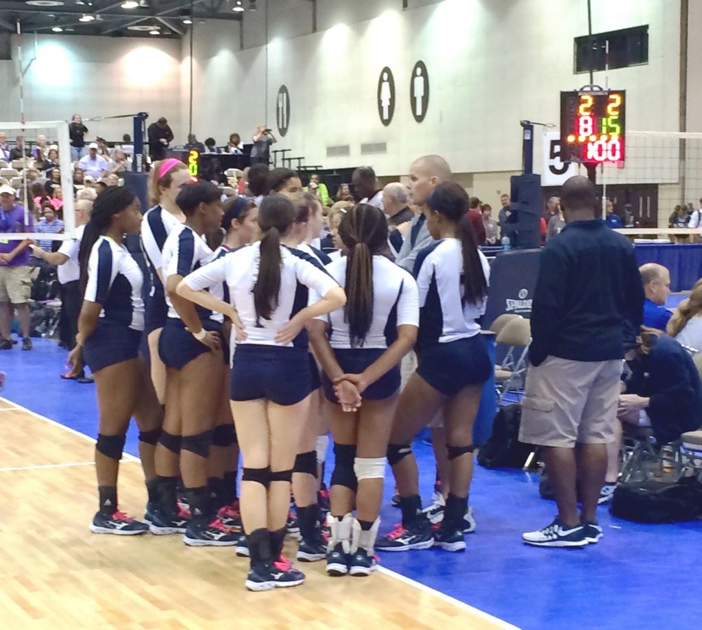 Jacksonville's volleyball team huddles after losing to Danville in the 4A North Super Regional final.