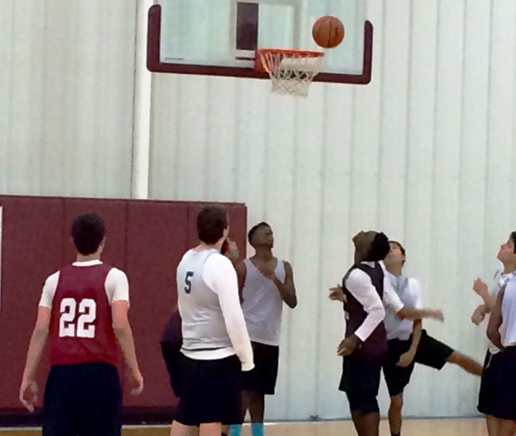 Sacred Heart players anxiously await the ball to drop for two or fall off the rim. 