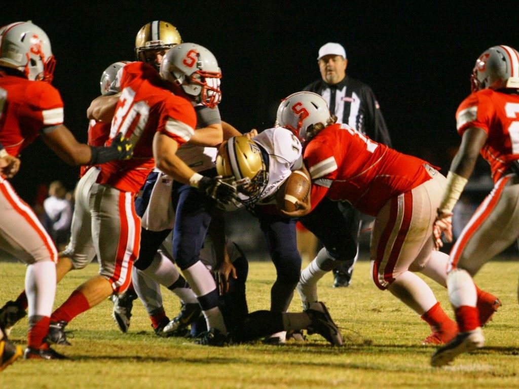 Jacksonville's Niko Richmond (13) gets bottled up by the Saks defense.