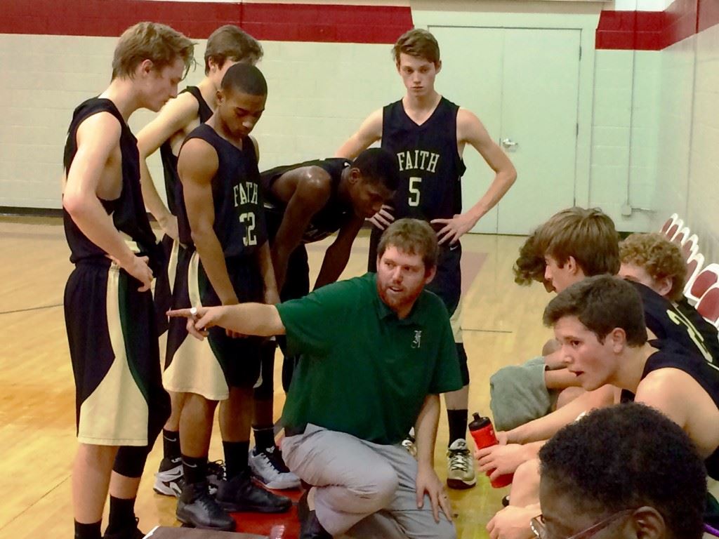 Faith Christian coach Bradley Dawson appeals to his team's tough side during a time out Thursday night.