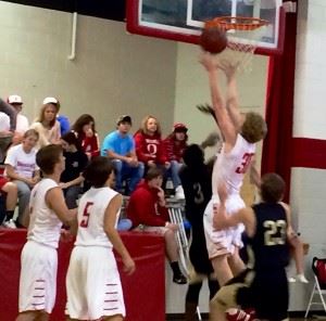 Ohatchee's Bryan Jennings (30) gets between Faith's Jordan Griswald (3) and Josiah McDaniel for one of his nine rebounds Thursday night.