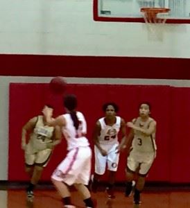 Ohatchee's Faith Walker (second from right) sends teammate Peyton Steinberg out on the break ahead of Faith's Elizabeth McCullough (L) and Emily Sills.