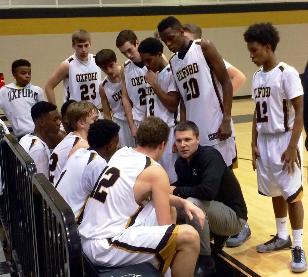 Oxford coach Joel Van Meter gives his team instructions during the final timeout with 41.5 seconds to play Saturday. The Yellow Jackets kept White Plains from scoring the rest of the game and secured a 63-56 victory.