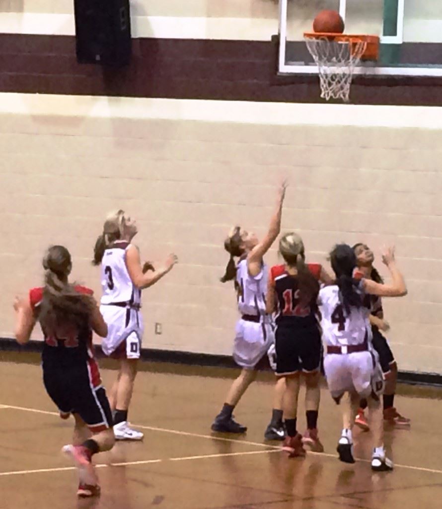 All eyes in the JCA-Donoho game watch this shot drop through the hoop during the first half Tuesday night.