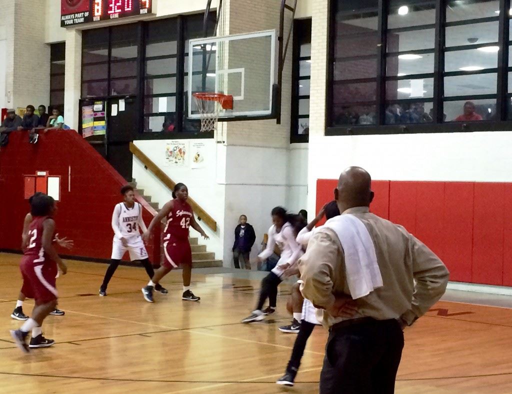 Anniston girls coach Eddie Bullock watches the early action unfold in Tuesday night's game with Sylacauga.