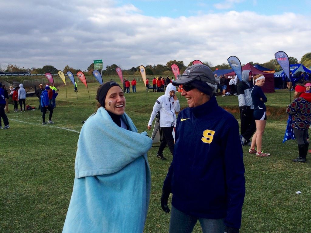 Eastern Kentucky senior Ann Eason (R) and her mother, Cindy, share a warm moment after Ann won the OVC women's cross country race.