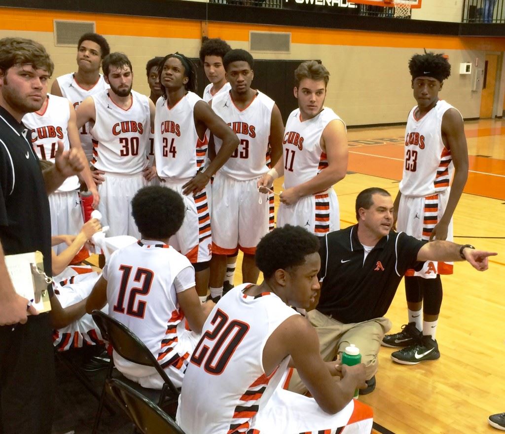 Alexandria basketball coach Jason Johnson tries to get somebody's attention during a timeout late in Tuesday night's game with Anniston.