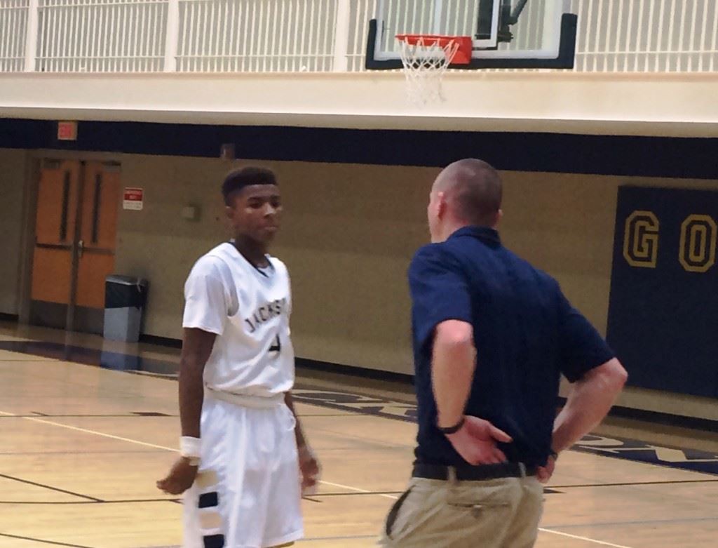 Cam Horton gets some instruction from Jacksonville coach Ryan Chambless during a second-half timeout in Thursday night's win over Weaver.