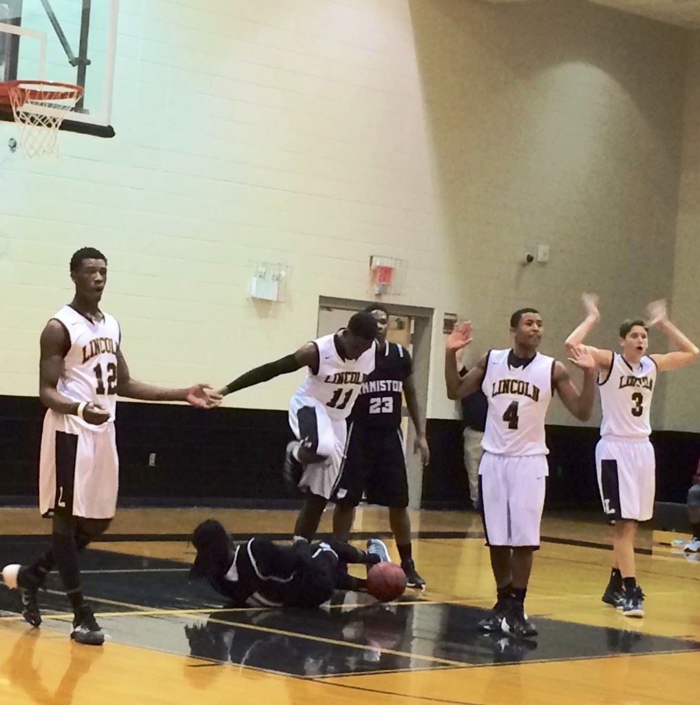 Lincoln players (from left) Dee Whiteside, Quin Carmichael, D.J. Bradford and Tyler Hemphill react to a whistle during Thursday's game with Anniston.