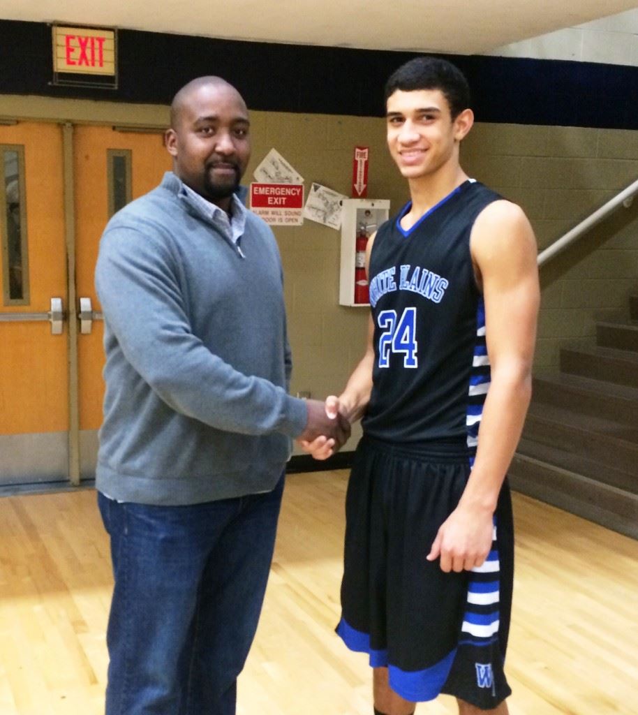 Jonathan Gilbert (left) is the only White Plains player to sign a Division I basketball scholarship, but his son Nathan could soon add to the family legacy. Below, Nathan (24) prepares to make his move in a recent game against Jacksonville. Nathan averages 19 points and nearly 10 rebounds a game this season.