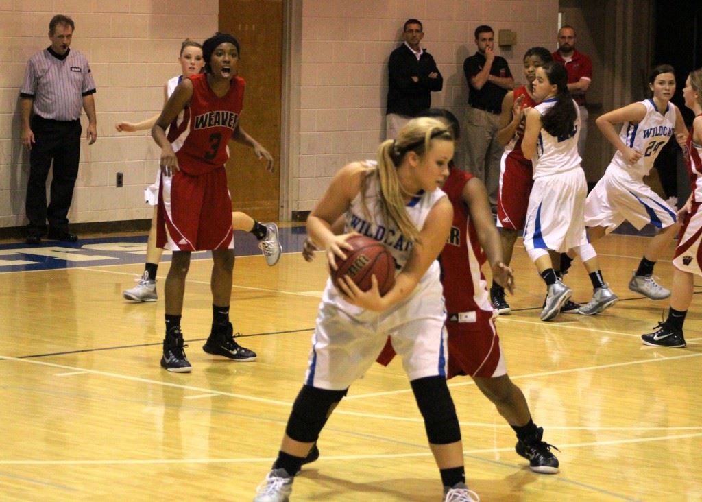 White Plains' Amber Greenwood tries to protect the basketball against Weaver pressure. (Photo by Micaela Truett)