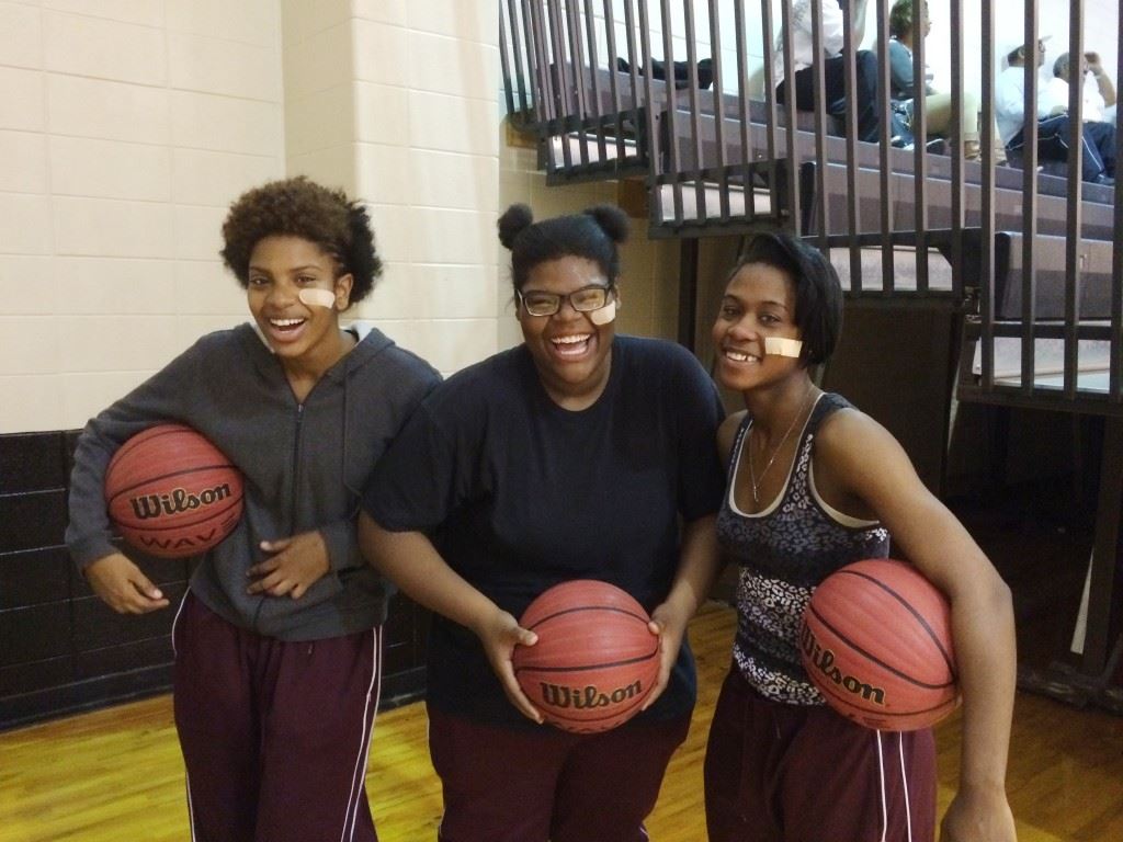 Ki-Yana Bullock (L), Jemya Bullock (C) and Raven Cooley display their team unity with band-aids under the left eye. It was an idea Jemya and Cooley floated earlier this year and it quickly spread through the team.