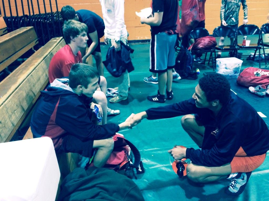 Weaver's Nick Souder (L) and Alexandria's Christian Knop, 30-win wrestlers in different weight classes from different schools, share a common story during Thursday's tri-match at Alexandria. 