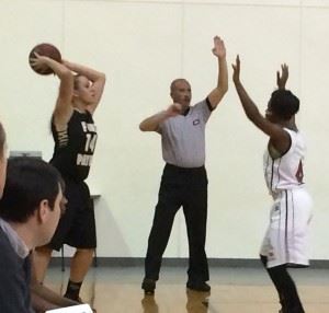 Anniston's Raven Cooley (4) applies tight defense on an inbounds play. On the cover, Jacksonville's Virginia Poe (4) goes over a play with Ataliya Morgan.