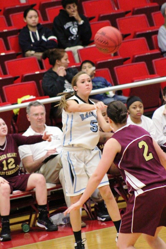 Pleasant Valley's Atleigh Brannon (5) puts the ball in play against Sacred Heart. On the front, backcourt mate Tiffany Williams brings the ball up the floor. (Special photos)