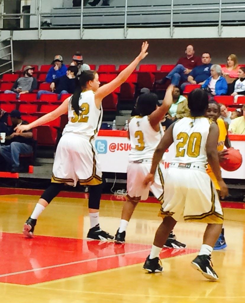 Jordan Smith (32), Makayla Kidd (3) and Tremeria Britt close in around a Piedmont ball handler Tuesday night.