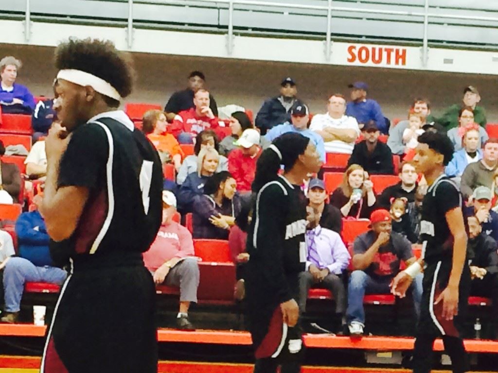 Anniston guards Marrio Dobbins (4), Hakeem Ross (11) and Tray Croft (10) frustrated Saks with their scoring and ball-handling skills Tuesday night.