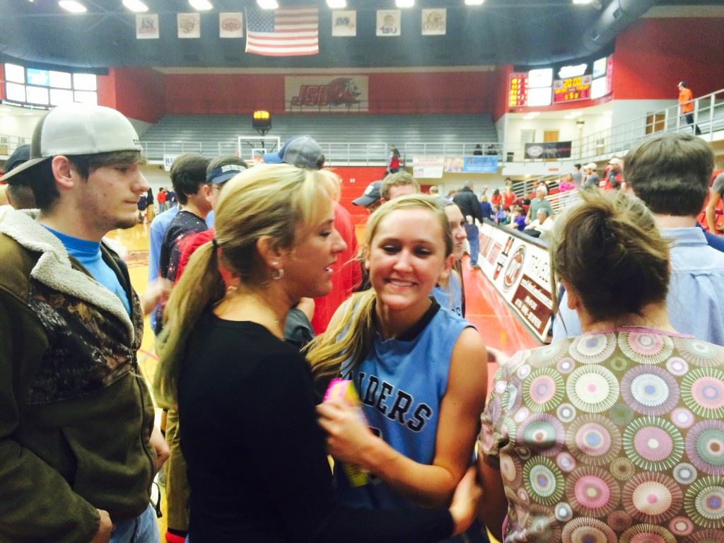 Pleasant Valley sophomore Atleigh Brannon gets a hero's reception after her big plays in overtime helped the Raiders upset Ohatchee. 