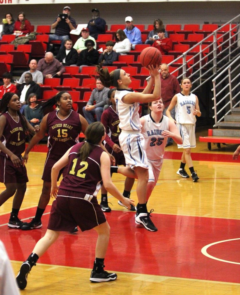 Tiffany Williams flies down the lane for a layup against Sacred Heart. (Photo by Krista Walker)