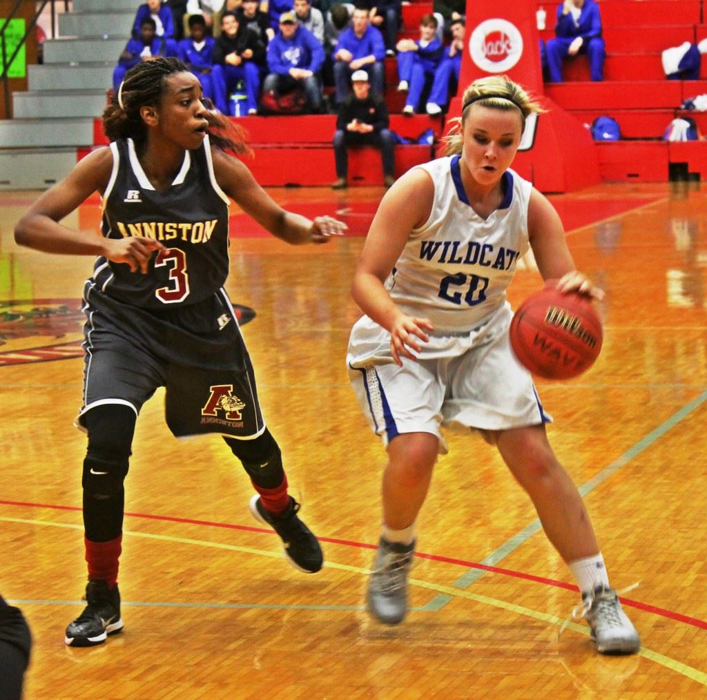 White Plains' Amber Greenwood (20) tries to dribble past Anniston's Miajah Bullock. On the cover, Anniston coach Eddie Bullock shouts instructions to his team on the floor. (Photos by Chad Barnett)