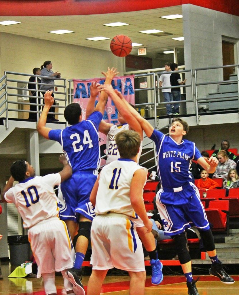 White Plains' Nathan Gilbert (24) and Michael McGuirk converge on Piedmont's Austin Brazier Wednesday. (Photo by Chad Barnett)