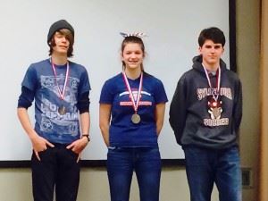 Pistol winner Katelyn Abeln is flanked by runnerup Jack Burrow (L) and Zachary Miller. Burrow earlier won the BB title.