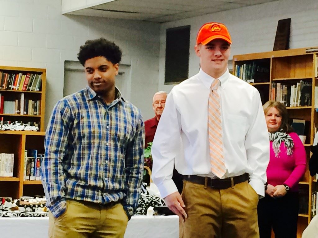 Quarterback/linebacker Landon Machristie and running back Kevin Mixon address the crowd in the Wellborn library after signing their letters of intent Wednesday. Machristie signed with Campbell, while Mixon signed with Lindsey Wilson.
