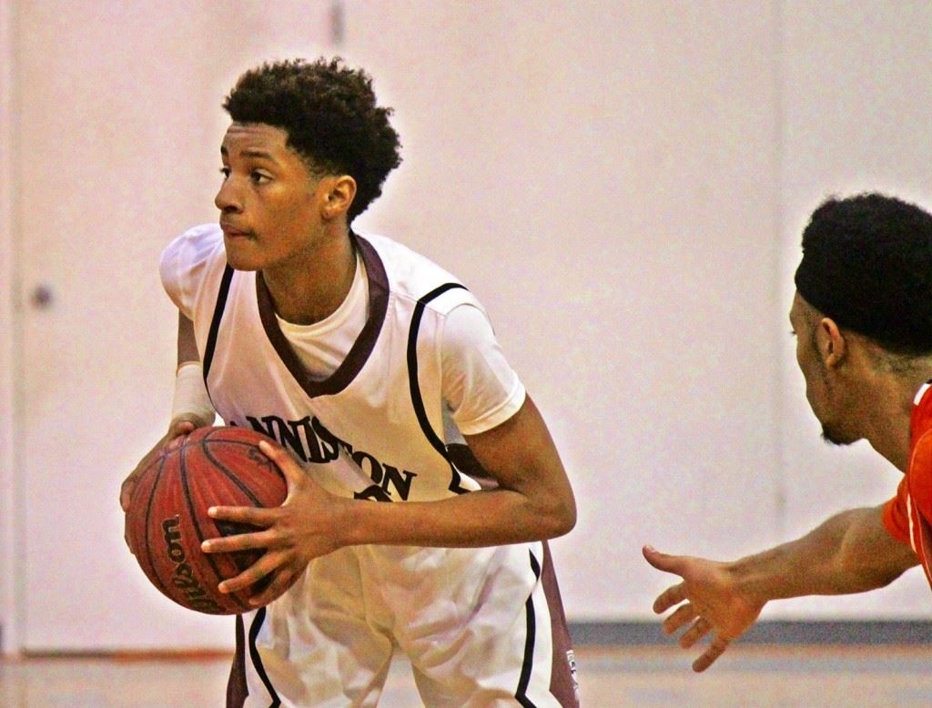 Anniston guard Tray Croft looks to make an outlet pass in the area tournament title game against Alexandria. On the cover, Croft follows through on one of his 20 shots. (Photos by Chad Barnett) 