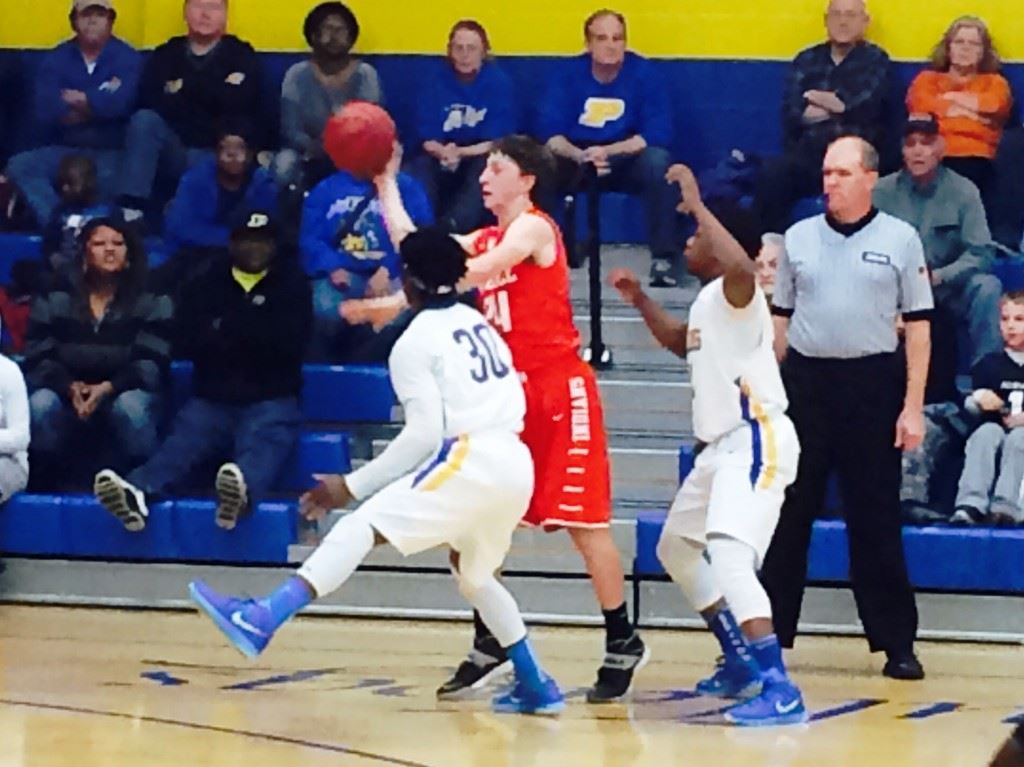 Piedmont's C.J. Savage (30) and Darnell Jackson turn up the heat on Ohatchee's Austin Tucker Tuesday night. The Bulldogs' press forced numerous turnovers they turned into baskets.