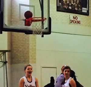 Alexandria's (from left) Timberlyn Shurbutt and Molly Parker wonder what's next after the ball balances on the back rim during their area tournament game Tuesday. On the cover, Connieya Bradford (right) played a big role in helping the Cubs grab the halftime lead.