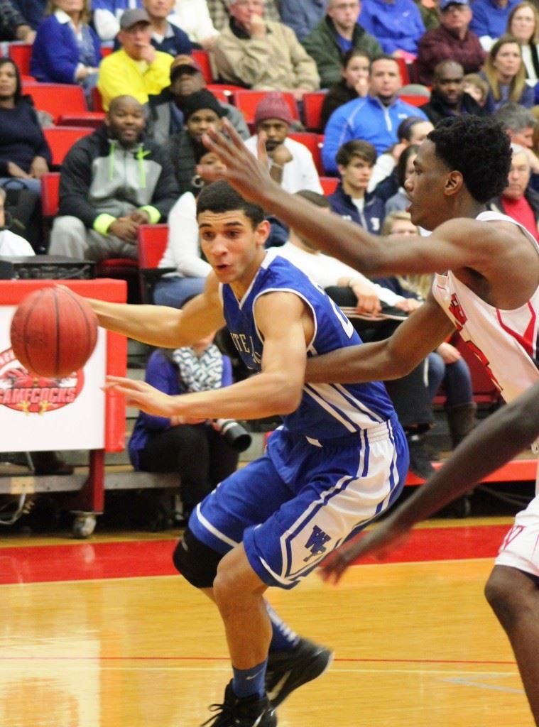 White Plains senior Nathan Gilbert drives past a Westminster defender Wednesday. Gilbert scored 14 points in his final high school game. (Photo by Bridget Merriman)