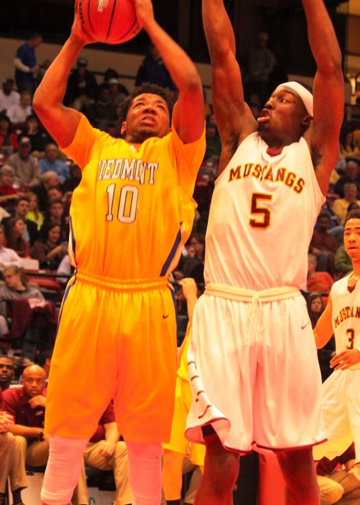 Piedmont's Darnell Jackson (10) goes to the basket against Madison Academy's Josh Langford in Friday's Class 3A boys championship game. Darnell was Piedmont's leading scorer, while Langford was the tournament MVP. (Photo by Shannon Fagan).