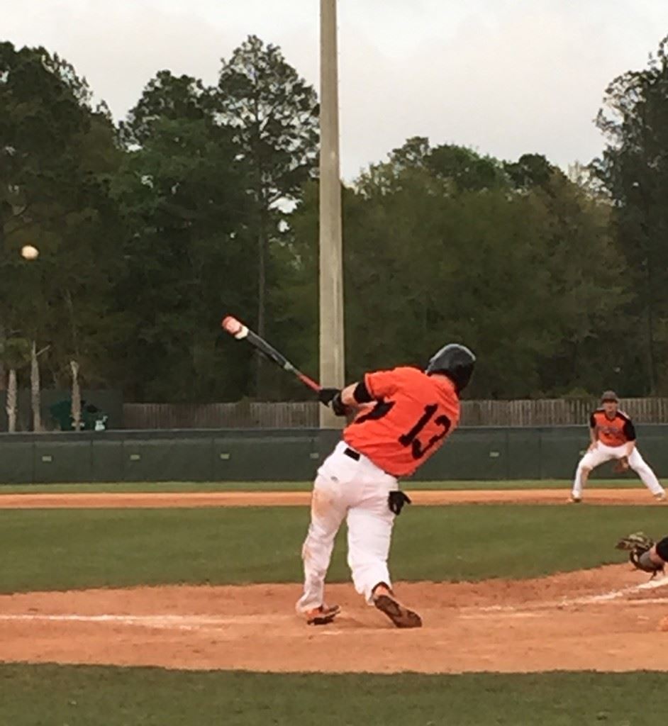 Alexandria's Dalton Cobb lifts a sacrifice fly in the Brooks game. (Special photo)