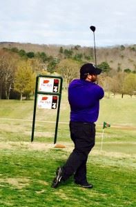 Caleb McKinney watches his drive fly down the fairway at Anniston Municipal Saturday.