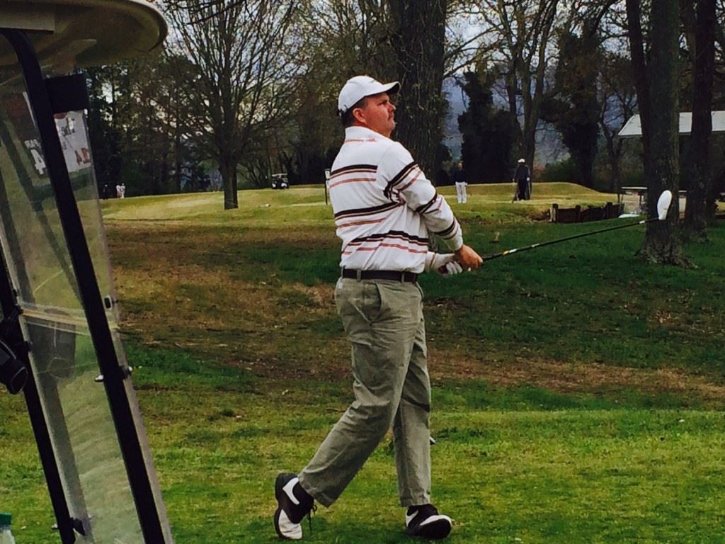 King of the Hill champion Gary Wigington follows his drive off the 14th tee Sunday.