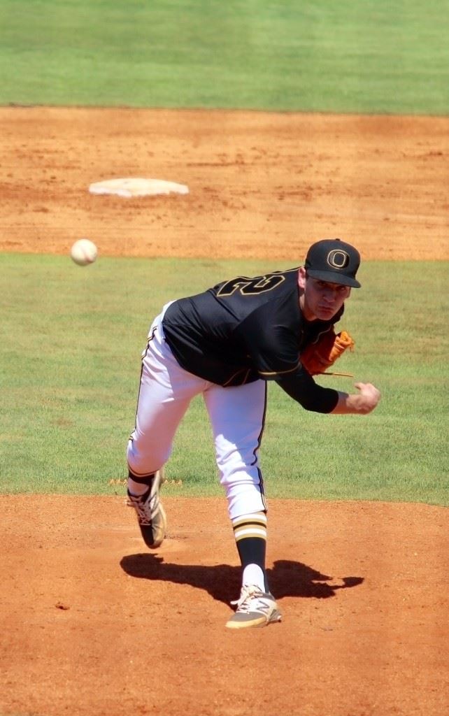 Oxford senior right-hander Mason Wilkins delivers a pitch in the early innings against Hoover Monday in the Buccaneer Classic. (Photo by Hub Roberts)